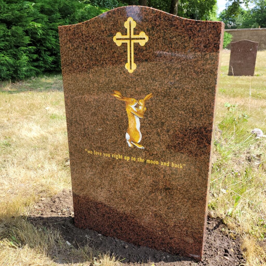 headstone by prince stone masons rabbits
